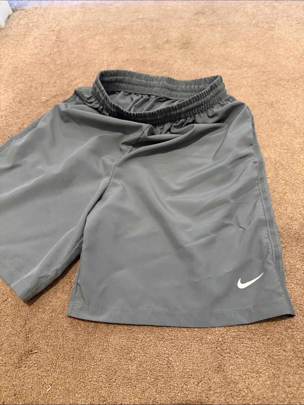Nike kid’s gray Athletic Shorts with White Swoosh